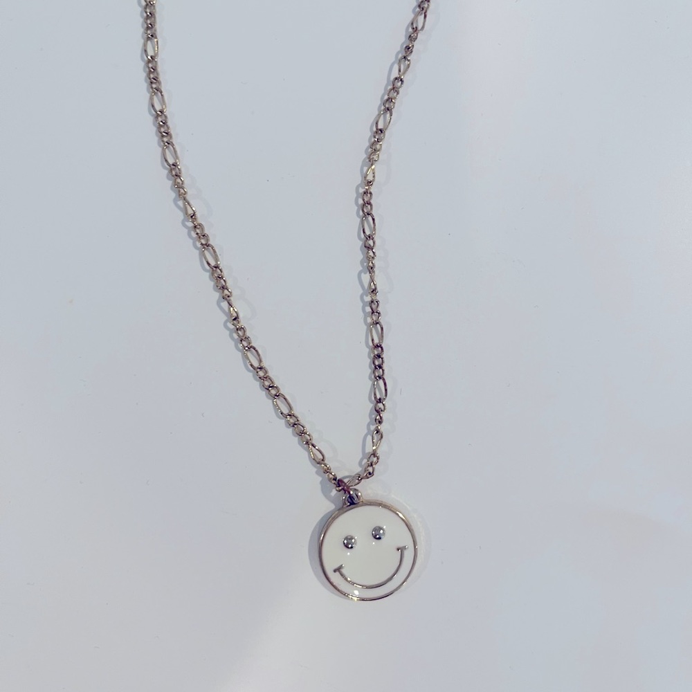 White and gold smiley face necklace